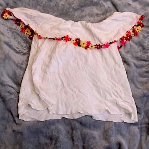 Shoulder showing shirt with flowers